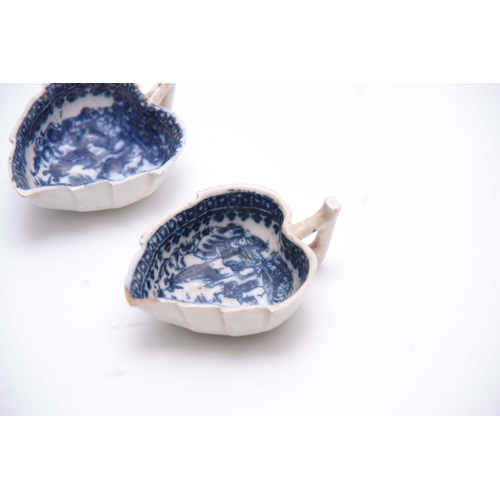 75 - AN EARLY PAIR OF BLUE AND WHITE LEAF SHAPED PEARLWARE PICKLE DISHES with oriental landscape decorati... 