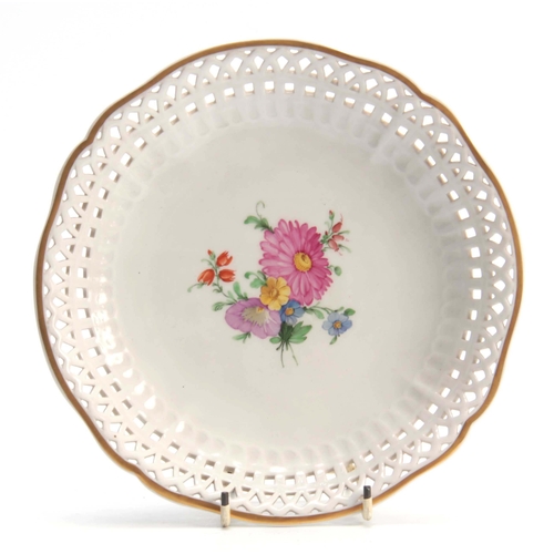 90 - A LATE 19TH CENTURY CIRCULAR KPM DISH with pierced edges and painted floral decoration 20cm diameter... 