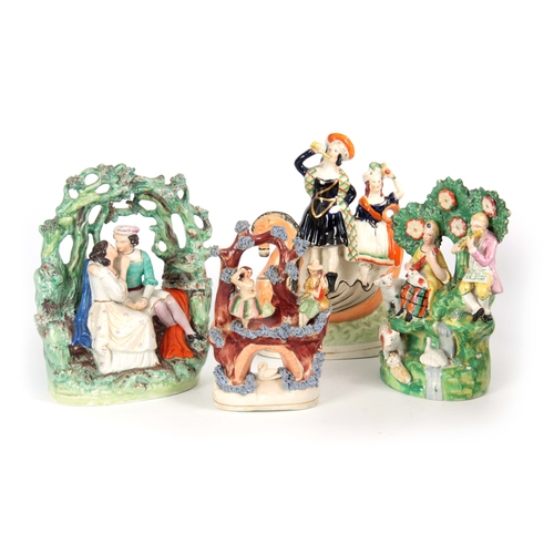 104 - A SELECTION OF FOUR 19TH CENTURY STAFFORDSHIRE FIGURE GROUPS comprising one with musicians and sheep... 