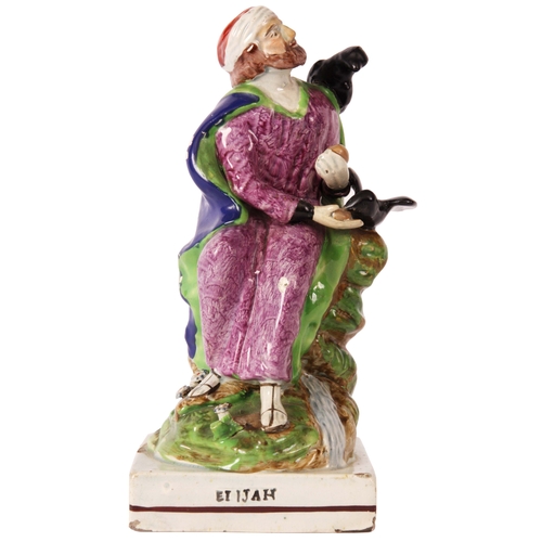 106 - An early 19th Century Ralph Wood type pearlware polychrome FIGURE of ELIJAH modelled in a seated pos... 