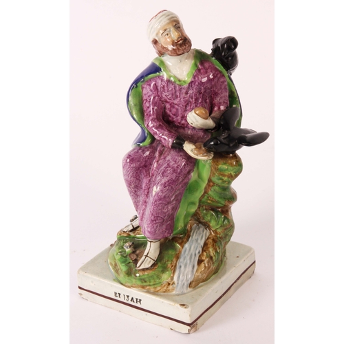 106 - An early 19th Century Ralph Wood type pearlware polychrome FIGURE of ELIJAH modelled in a seated pos... 