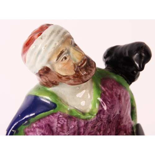 106 - An early 19th Century Ralph Wood type pearlware polychrome FIGURE of ELIJAH modelled in a seated pos... 