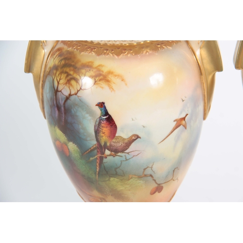 108 - A. LEWIS. A PAIR OF ROYAL WORCESTER VASES of ovoid shape on socle feet with slender gilt necks and s... 