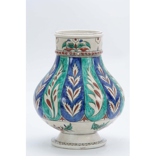 116 - A 19TH CENTURY ISNIC BALUSTER VASE decorated with brightly coloured leaf work bands 35cm high.