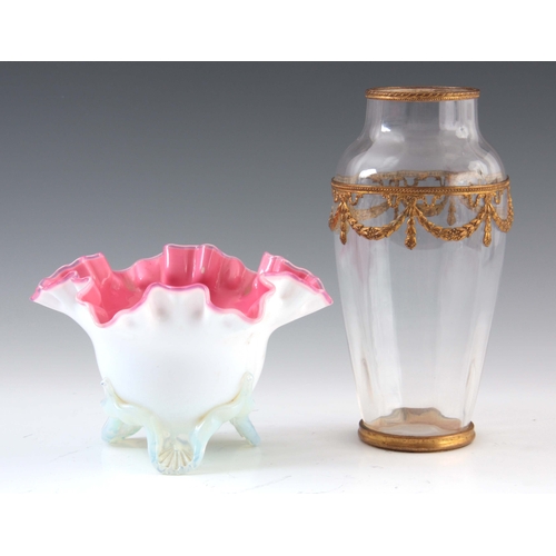 12 - A 19TH CENTURY PINK LINED OPALINE GLASS VASE standing on a shell moulded tripod base, 11cm high, 17c... 