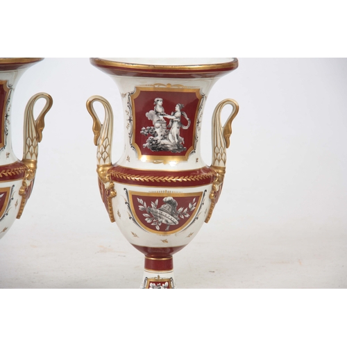 122 - A PAIR OF 19TH CENTURY PARIS HARD PORCELAIN CAMPAGNE SHAPED VASES with gilded rust panels and border... 