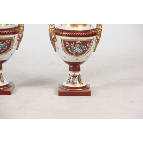 122 - A PAIR OF 19TH CENTURY PARIS HARD PORCELAIN CAMPAGNE SHAPED VASES with gilded rust panels and border... 