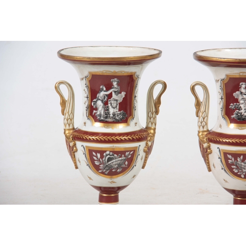 122 - A PAIR OF 19TH CENTURY PARIS HARD PORCELAIN CAMPAGNE SHAPED VASES with gilded rust panels and border... 