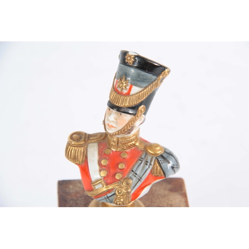 128 - A MID 20TH CENTURY GERMAN PORCELAIN FIGURE OF A 19TH CENTURY OFFICER BY KAMMER RUDOLPH written to re... 