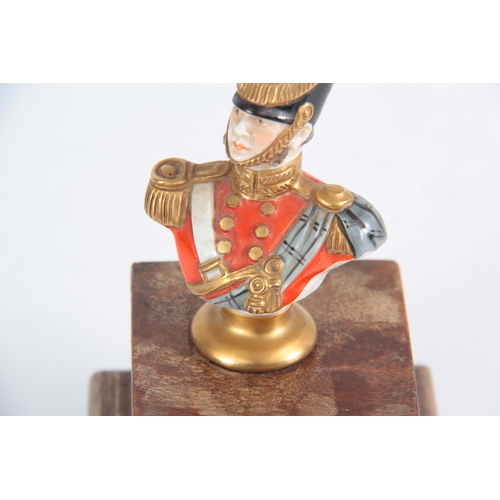 128 - A MID 20TH CENTURY GERMAN PORCELAIN FIGURE OF A 19TH CENTURY OFFICER BY KAMMER RUDOLPH written to re... 