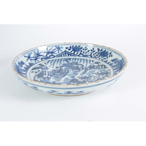 136 - A 17TH / 18TH CENTURY CHINESE BLUE AND WHITE DISH decorated with figures in a garden and on horse ba... 