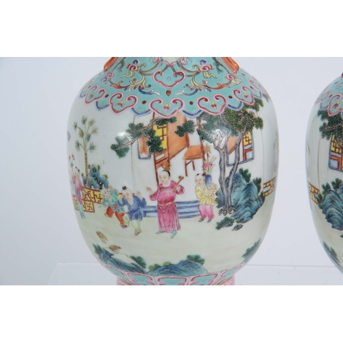 138 - A PAIR OF CHINESE REPUBLIC LATE 19TH CENTURY FAMILLE ROSE VASES decorated with continuous garden sce... 