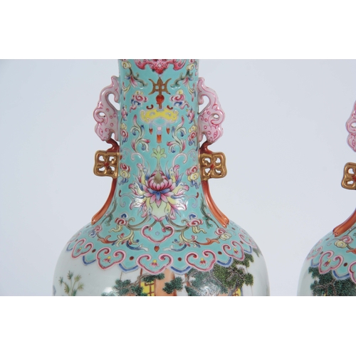 138 - A PAIR OF CHINESE REPUBLIC LATE 19TH CENTURY FAMILLE ROSE VASES decorated with continuous garden sce... 