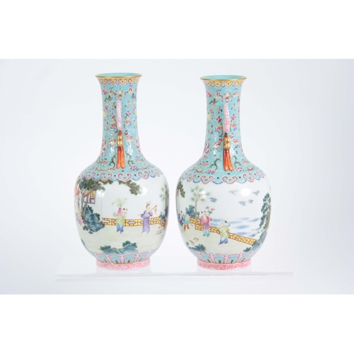 138 - A PAIR OF CHINESE REPUBLIC LATE 19TH CENTURY FAMILLE ROSE VASES decorated with continuous garden sce... 