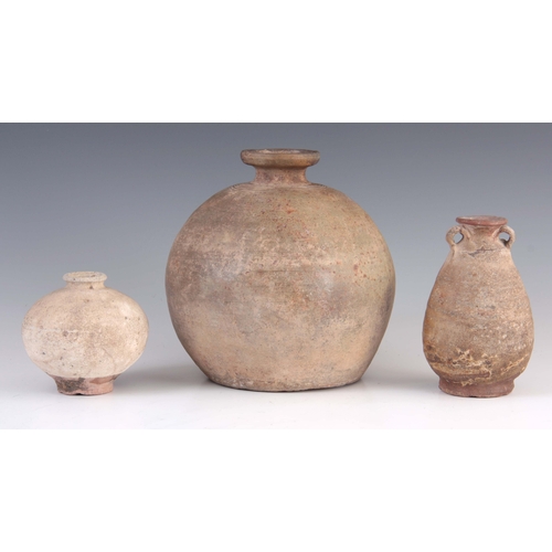 145 - THREE ANTIQUE CHINESE UNGLAZED STONEWARE VASES one of spherical shape 20cm, another ovoid with two s... 