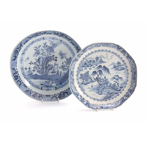 153 - AN 18TH CENTURY CHINESE BLUE AND WHITE SHALLOW DISH with fenced garden scene and butterfly centre en... 