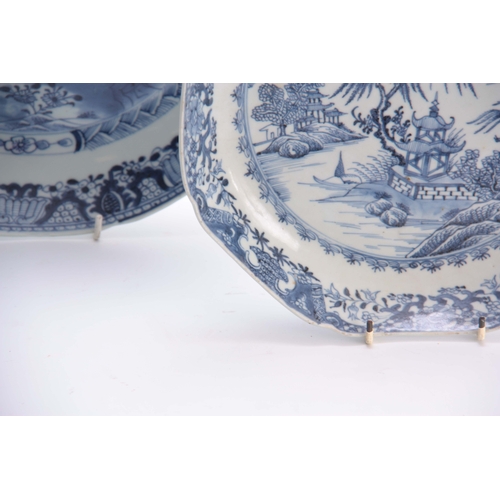 153 - AN 18TH CENTURY CHINESE BLUE AND WHITE SHALLOW DISH with fenced garden scene and butterfly centre en... 