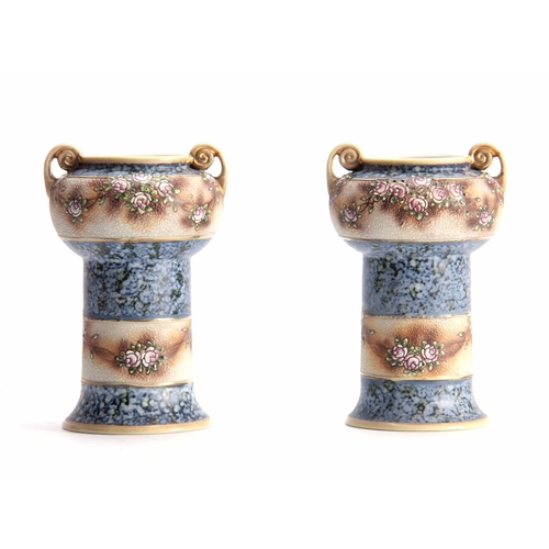 161 - AN UNUSUAL PAIR OF NORITAKE JAPANESE VASES with two-handled rounded upper sections on plain stems de... 