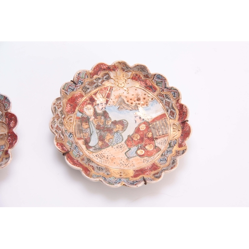 170 - A PAIR OF 20TH CENTURY JAPANESE SATSUMA SIDE PLATES with scalloped edges, decorated with figures 17c... 