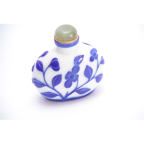 173 - A 19TH CENTURY OVERSIZED CHINESE PEKING GLASS SNUFF BOTTLE WITH ROUNDED JADE STOPPER the  opaque fla... 