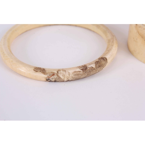 175 - A 19th CENTURY JAPANESE IVORY OKIMONO 11cm, together with a Japanese ivory bangle decorated with tig... 