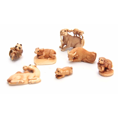 179 - A COLLECTION OF SEVEN EARLY 20TH CENTURY IVORY NETSUKE sculptured as various animals all with charac... 