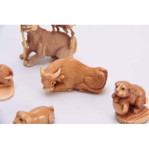 179 - A COLLECTION OF SEVEN EARLY 20TH CENTURY IVORY NETSUKE sculptured as various animals all with charac... 