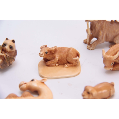 179 - A COLLECTION OF SEVEN EARLY 20TH CENTURY IVORY NETSUKE sculptured as various animals all with charac... 