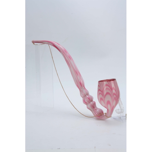 18 - A LARGE 19TH CENTURY STOURBRIDGE GLASS PIPE of twisted pink and opaque design 50cm overall.