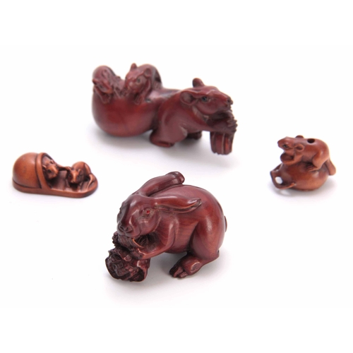 180 - A COLLECTION OF FOUR EARLY 20th CENTURY NETSUKE sculptured as various animals all with character mar... 