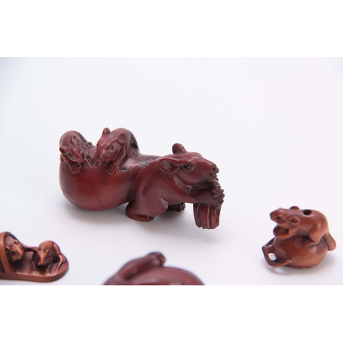 180 - A COLLECTION OF FOUR EARLY 20th CENTURY NETSUKE sculptured as various animals all with character mar... 