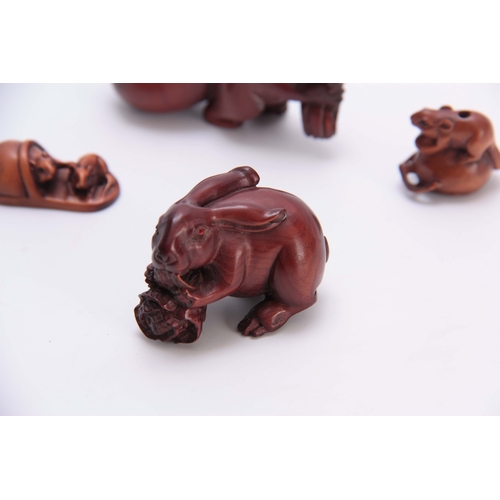 180 - A COLLECTION OF FOUR EARLY 20th CENTURY NETSUKE sculptured as various animals all with character mar... 