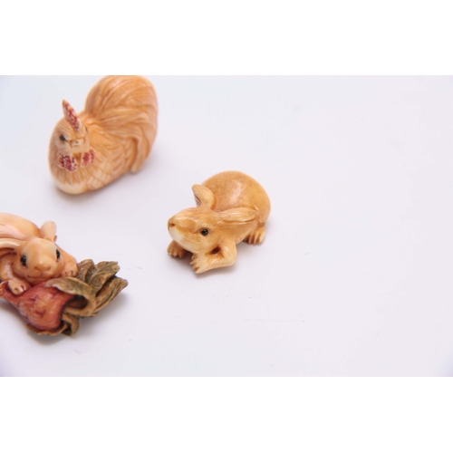 186 - A COLLECTION OF SEVEN EARLY 20TH CENTURY IVORY NETSUKE sculptured as rabbits, fish, hen, and octopus... 