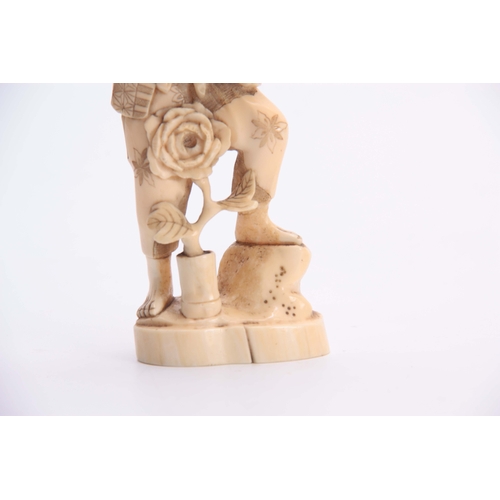 187 - A GOOD 19TH CENTURY JAPANESE CARVED IVORY TOWER FIGURE finely detailed with engraved decoration on a... 