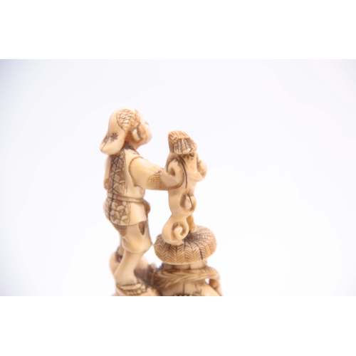 187 - A GOOD 19TH CENTURY JAPANESE CARVED IVORY TOWER FIGURE finely detailed with engraved decoration on a... 