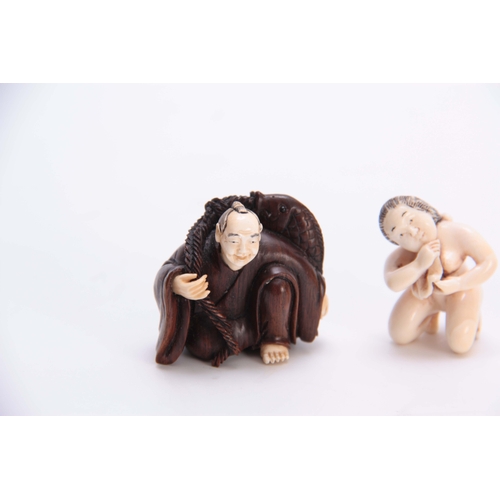 188 - A COLLECTION OF THREE EARLY 20th CENTURY IVORY AND HARDWOOD NETSUKE sculptured as various figures al... 