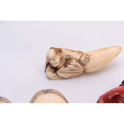 189 - A COLLECTION OF FOUR EARLY 20th CENTURY IVORY NETSUKE three with character marks (4)