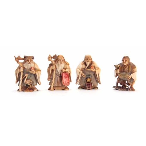 191 - A SET OF FOUR EARLY 20th CENTURY STAINED IVORY NETSUKE sculptured as for elderly men, all with chara... 