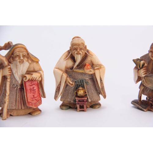 191 - A SET OF FOUR EARLY 20th CENTURY STAINED IVORY NETSUKE sculptured as for elderly men, all with chara... 