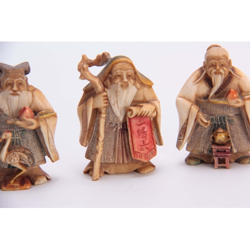 191 - A SET OF FOUR EARLY 20th CENTURY STAINED IVORY NETSUKE sculptured as for elderly men, all with chara... 