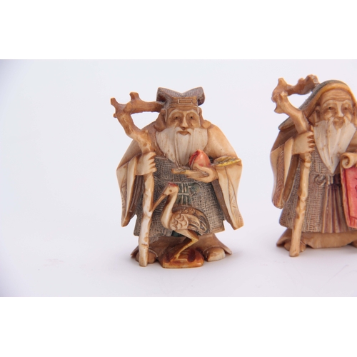 191 - A SET OF FOUR EARLY 20th CENTURY STAINED IVORY NETSUKE sculptured as for elderly men, all with chara... 