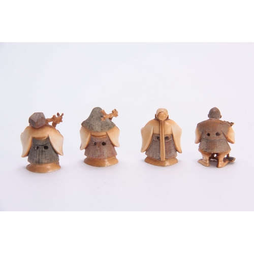 191 - A SET OF FOUR EARLY 20th CENTURY STAINED IVORY NETSUKE sculptured as for elderly men, all with chara... 