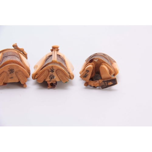 191 - A SET OF FOUR EARLY 20th CENTURY STAINED IVORY NETSUKE sculptured as for elderly men, all with chara... 