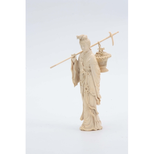 193 - A 19TH CENTURY CHINESE CARVED IVORY FIGURE OF A STANDING YOUNG LADY in elaborate costume carrying a ... 