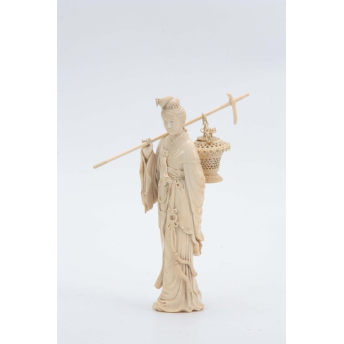 193 - A 19TH CENTURY CHINESE CARVED IVORY FIGURE OF A STANDING YOUNG LADY in elaborate costume carrying a ... 