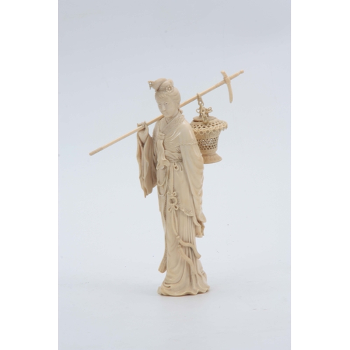 193 - A 19TH CENTURY CHINESE CARVED IVORY FIGURE OF A STANDING YOUNG LADY in elaborate costume carrying a ... 