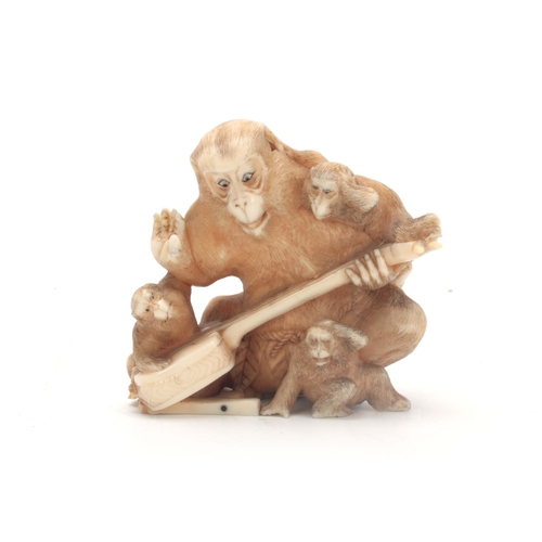 198 - A MEIJI PERIOD JAPANESE IVORY OKIMONO modelled as a group of monkeys holding a Shamisen instrument 6... 