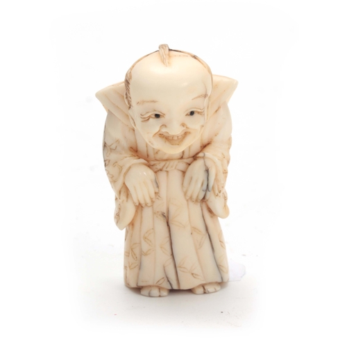 203 - A JAPANESE MEIJI PERIOD IVORY NETSUKE WITH ARTICULATED HEAD the figure of a standing elderly man wit... 