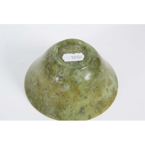 212 - A CHINESE TRANSLUCENT NEPHRITE FOOTED BOWL spinach green with emerald markings and speckled black 12... 