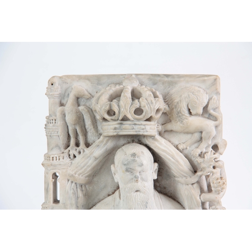 219 - AN UNUSUAL CARVED WHITE MARBLE ANGLO INDIAN BUDDHA decorated with a Royal coat of arms to the top ab... 